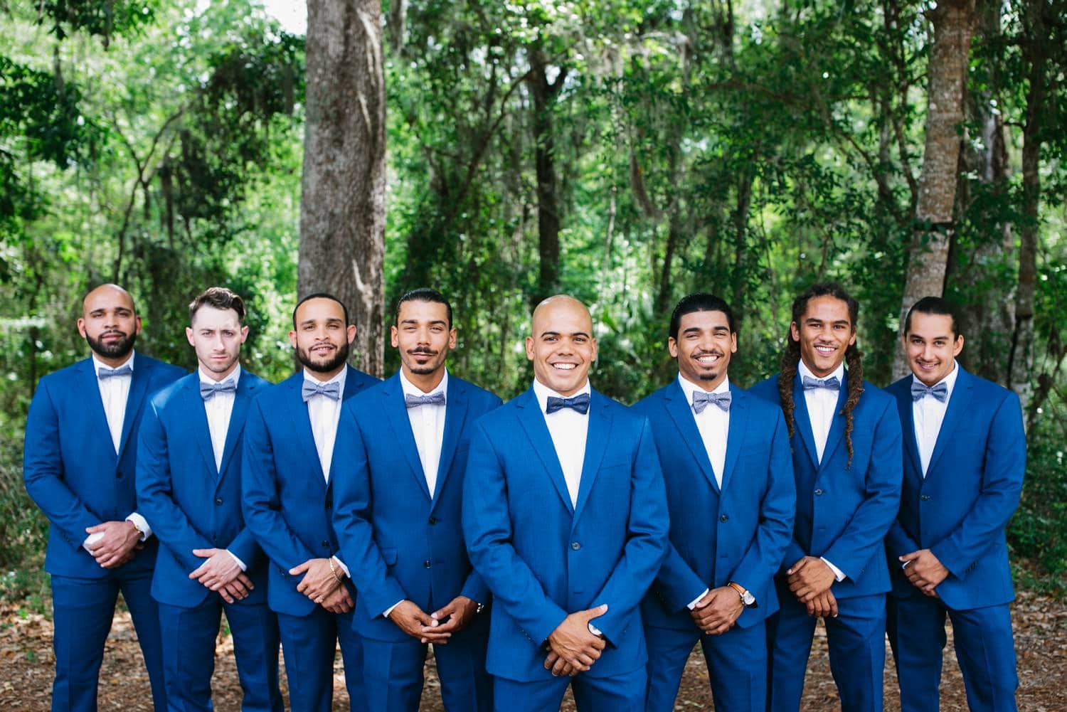 Groom and his groomsmen wearing royal blue suits. Rustic chic wedding at October Oaks Farm.
