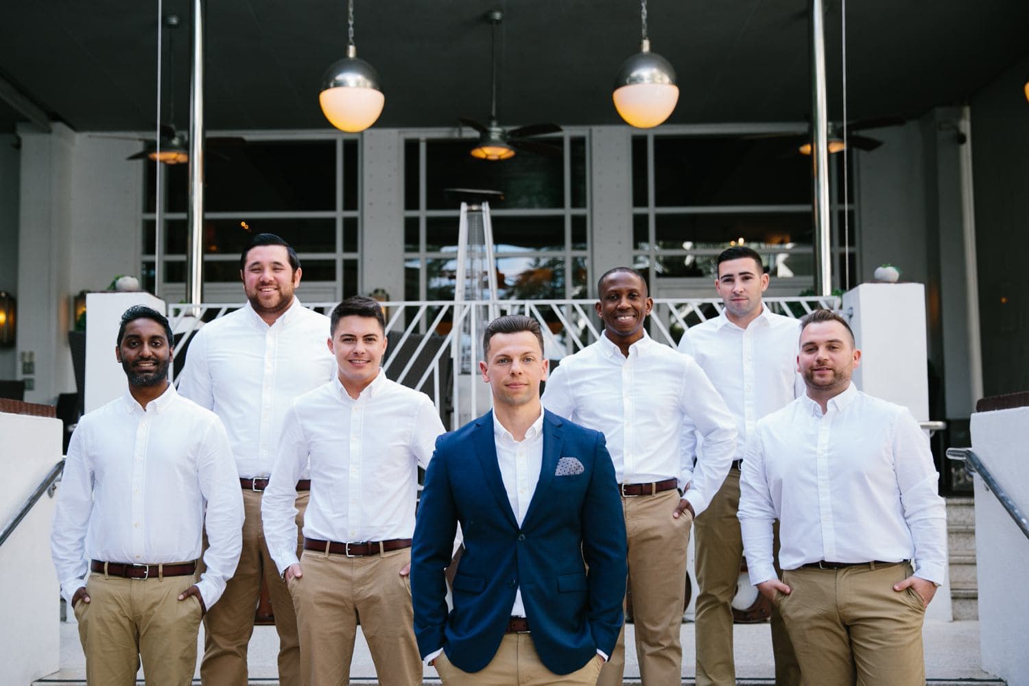 Groom and Groomsmen portrait. Khaki pants and blue jacket suit. Winter Beach Wedding at the National Hotel in South Beach Fl 