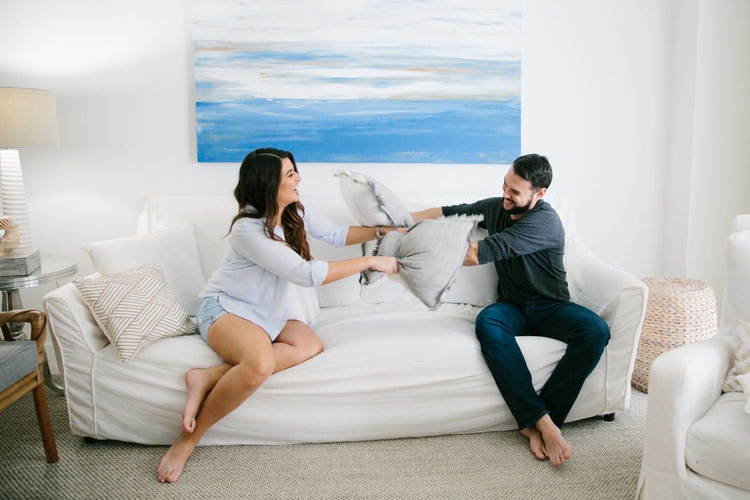 couple having a pillow fight at home