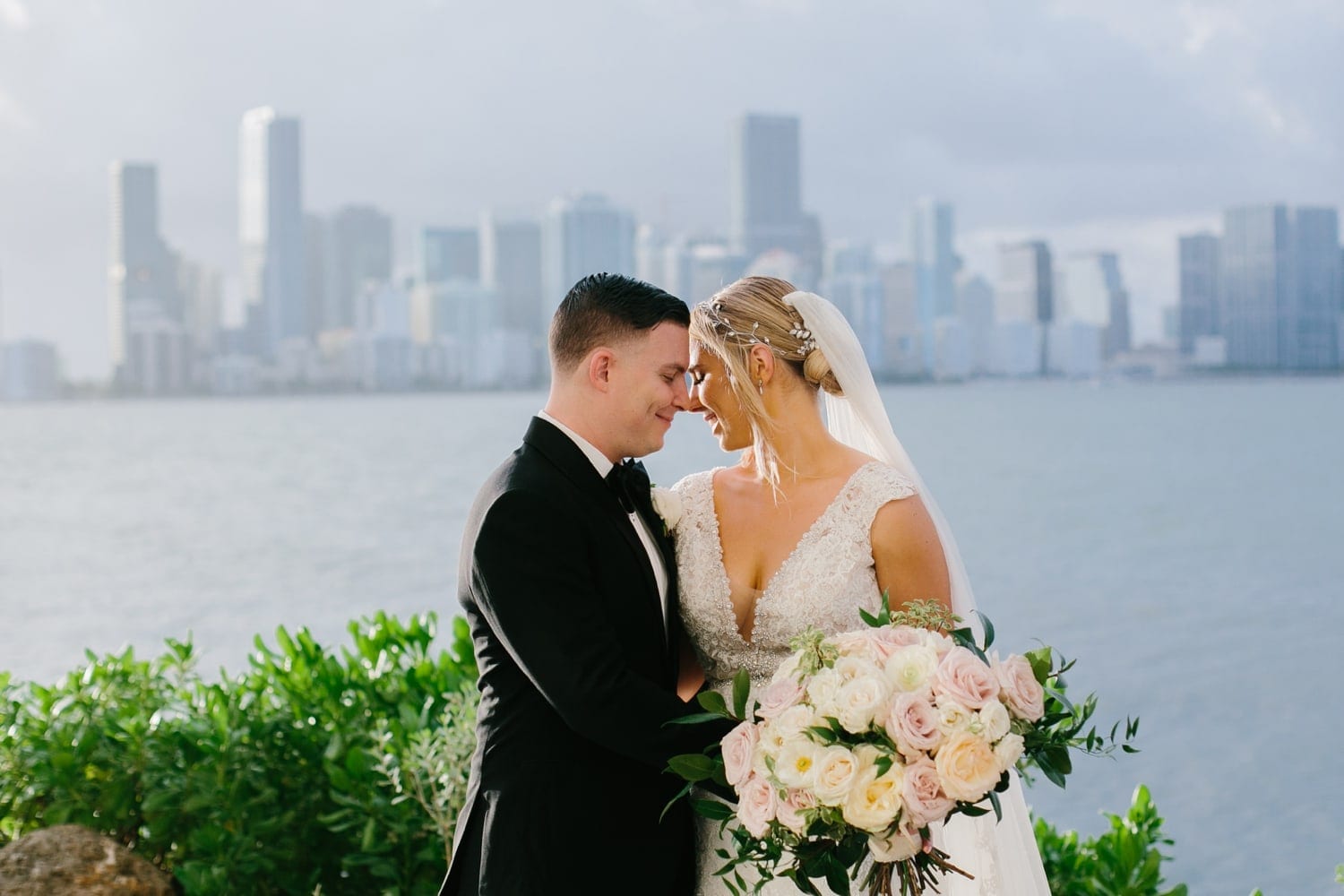 Romantic wedding photos at the Rusty Pelican Miami. Miami Wedding Photographer 