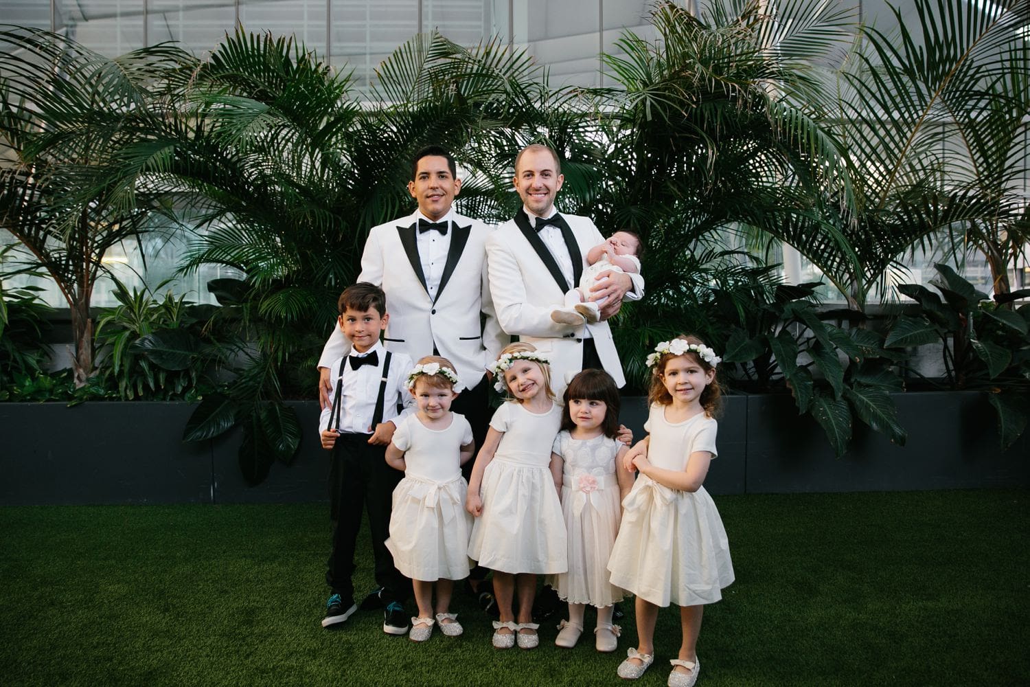 Wedding couple posing with the wedding party. Elegant Chic Miami Wedding at The East Hotel
