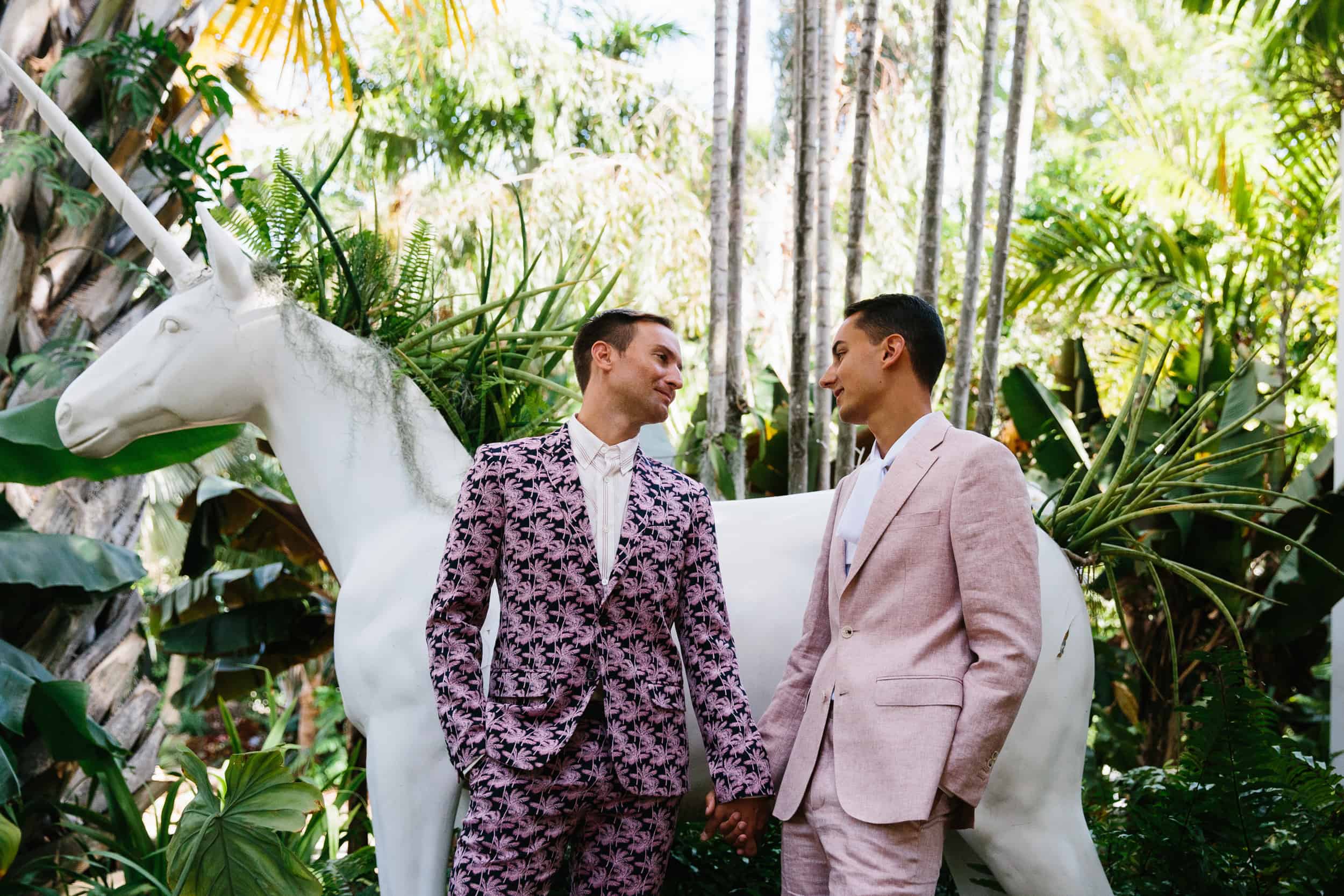 couple wearing colorful suits posing during their wedding