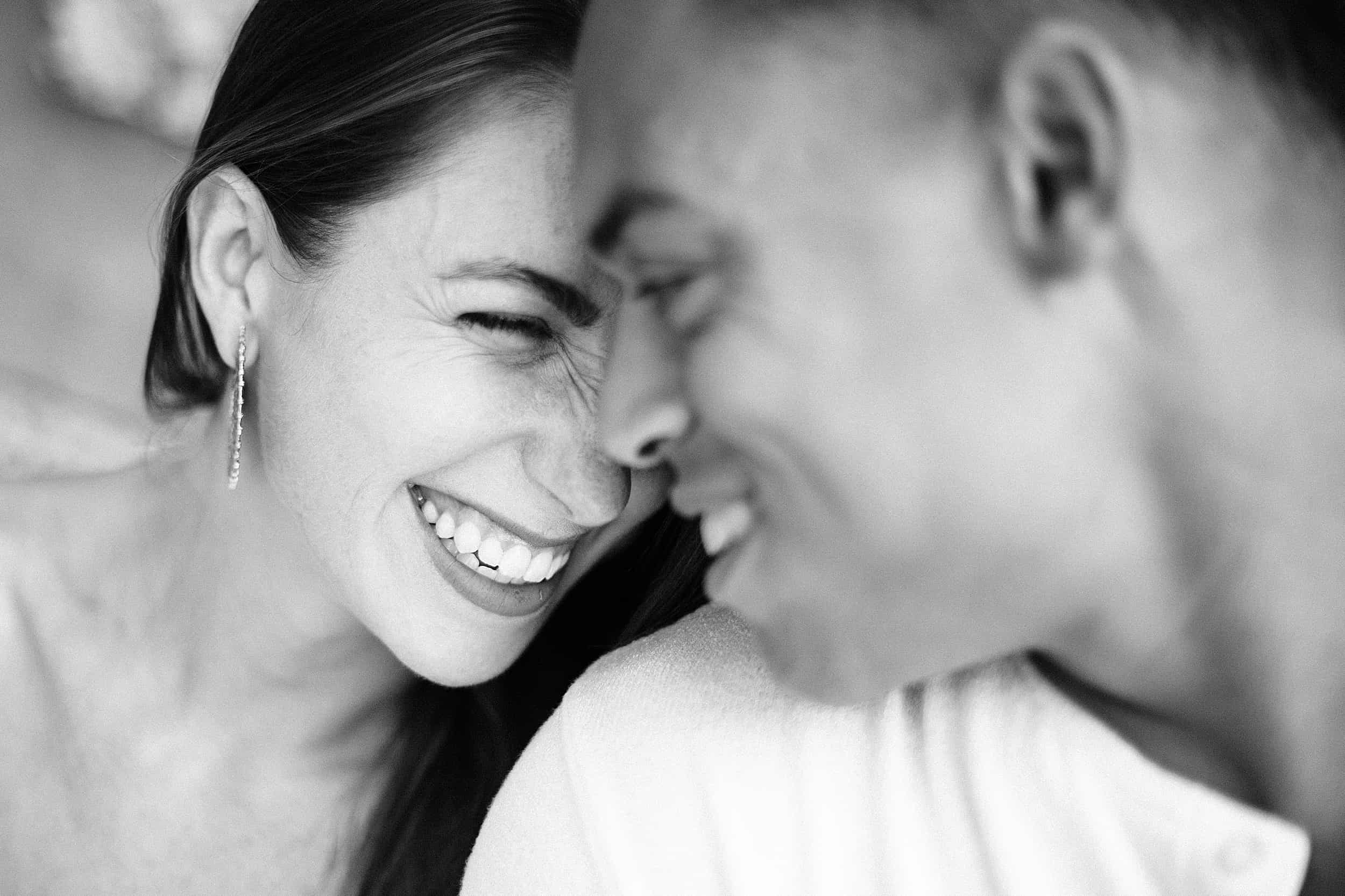 closeup image of couple smiling and having a romantic moment during their engagement session