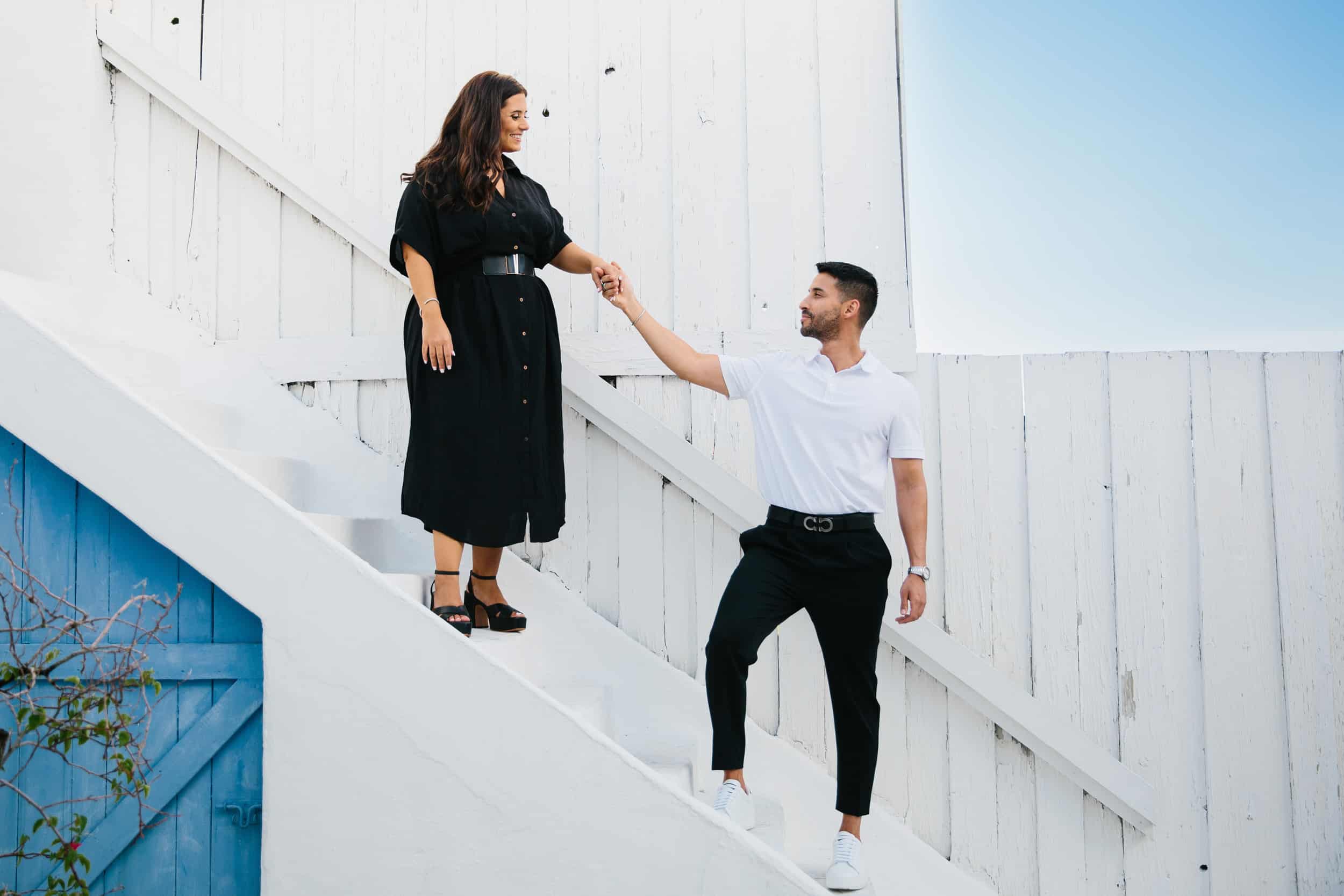 Couple walking down the stairs during their engagement session 