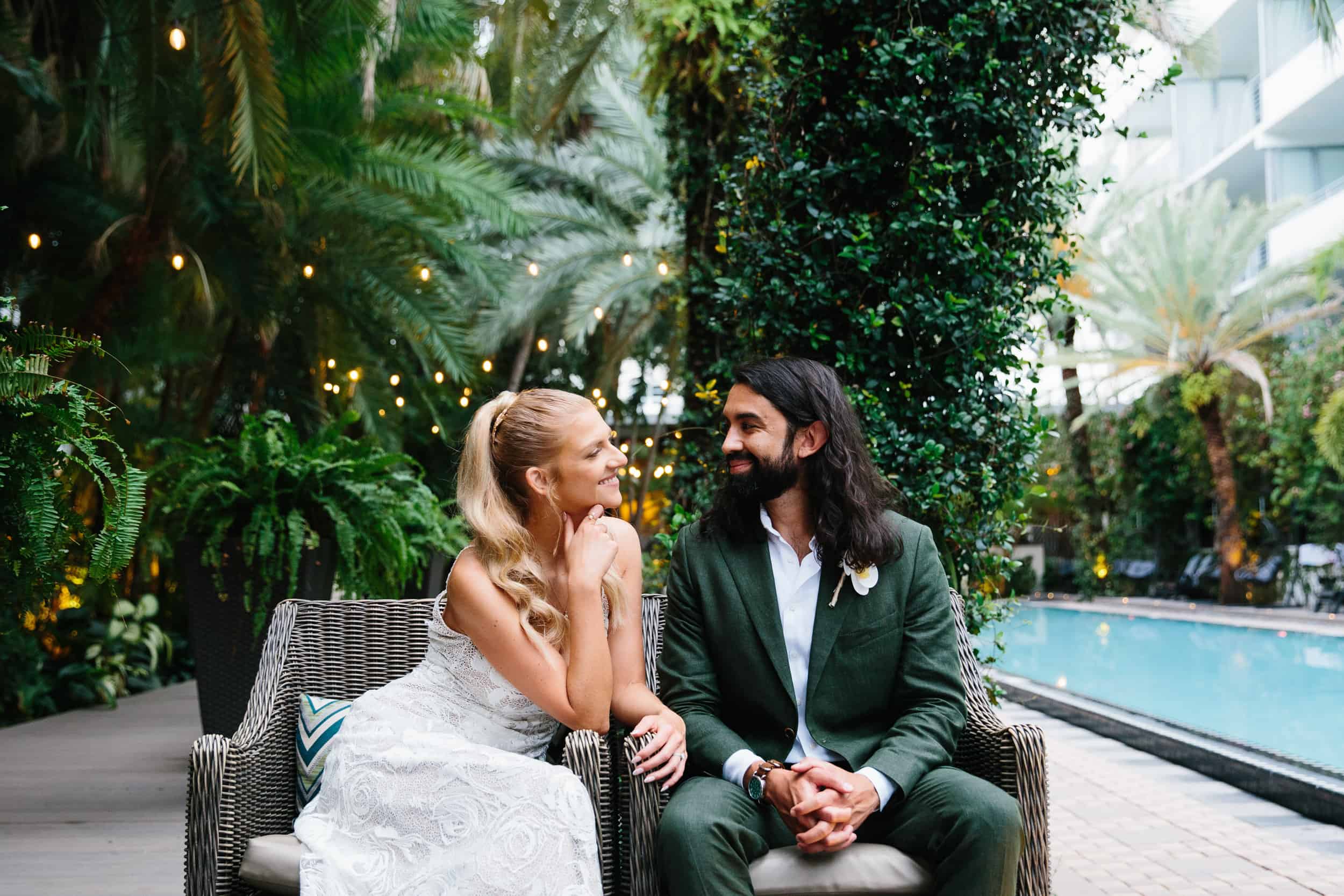 Couple sitting by the pool after their Miami Elopement 